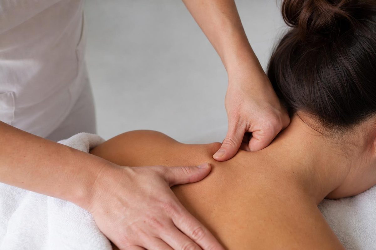 Chiropractor performing a gentle neck adjustment on a patient at Crest Hill Clinic near Joliet