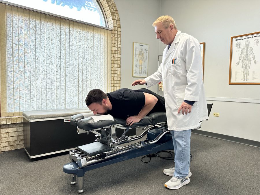 Dr. Balsier performing a chiropractic adjustment