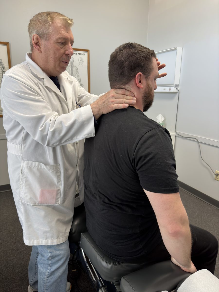 Dr. Balsier performing a neck assessment