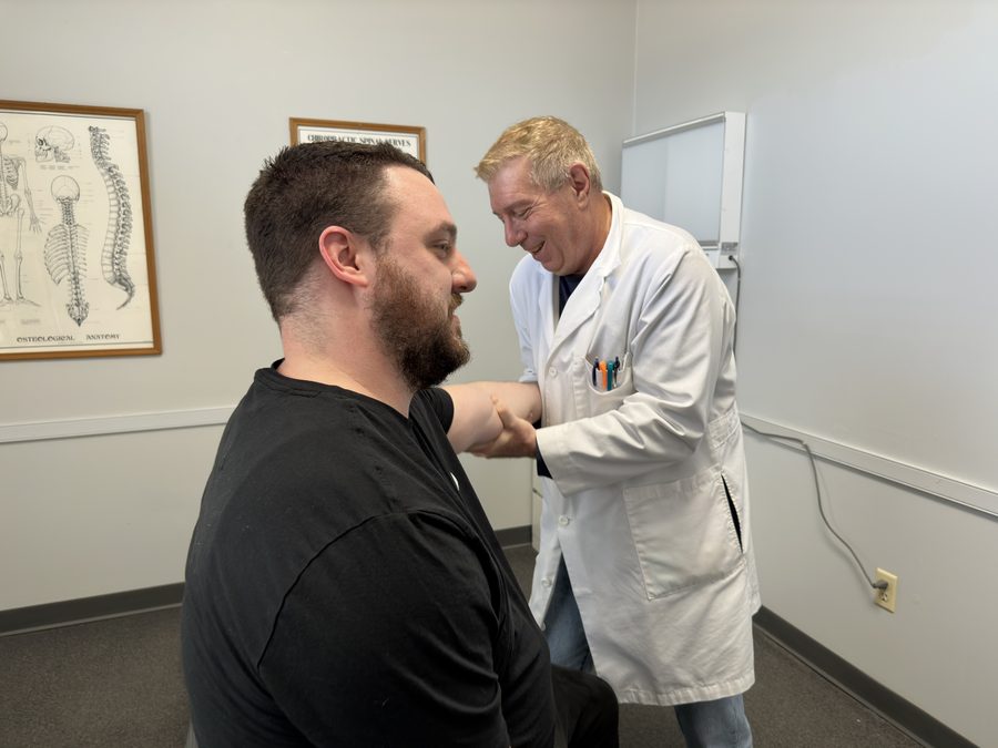 Dr. Balsier with a patient at Crest Hill Clinic